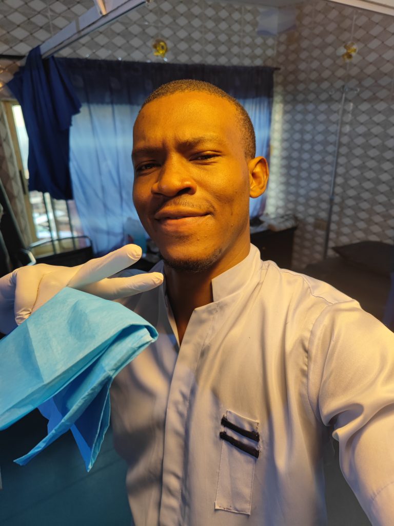 Me holding a delivery mat cut in half 